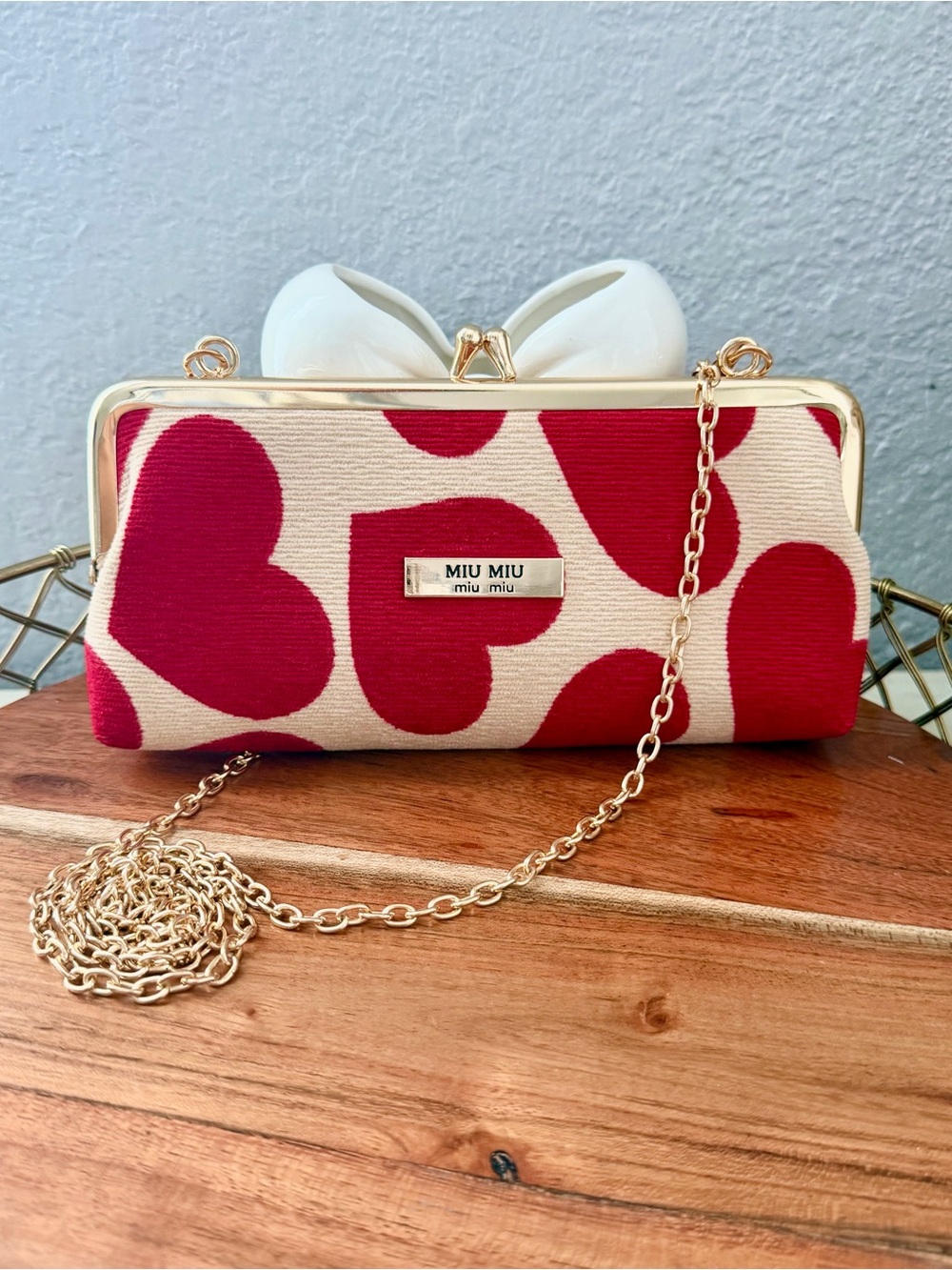 Miu Miu Cream Clutch with Red Heart Print and White Bow
